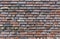 Close-up of a Brick wall. Decorative masonry using curves, non-standard bricks. Brick wall background. Horizontal orientation of t