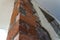 Close up of bricklaying industrial installing bricks on construction site wall