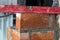 Close up of bricklaying industrial installing bricks on construction site wall with working tools, mortar, level