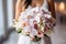 Close up of a bridal bouquet in the hands of a bride created with generative AI technology