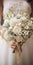 Close-up of bride holding wedding flowers bouquet