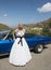 Close up of Bride next to wedding car