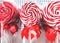 Close-up of bright colorful striped red and white lollipops