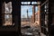 close-up of broken windows and doors, with the view of smokestacks and machinery in the background