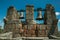 Close-up of bronze bells on top of stone brick wall