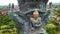 Close up of a bronze statue of Garuda in the grounds with the tourist attraction GWK. Aerial view of massive statue of