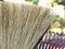 Close-up of a broom and a rake.