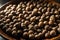 Close-up of brown allspice jamaica pepper grains in the bright sunlight. Texture of whole dried pimento berries. Concepts of