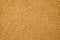 Close-up of brown cork board texture background. Empty bulletin board, natural texture