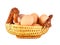 Close up of brown eggs in a basket. Chicken eggs. Fresh eggs on a white background