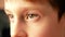 Close up of brown eyes of a Caucasian boy gazing into the distance. Profile portrait of a child listening with the teacher`s atten