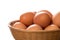 Close Up of Brown Hen Eggs in Wicker Tray