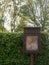 Close up of a brown old and unused wooden notice board outside n