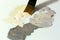 Close up of Brush mixing colors Paints on white Palette