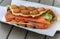 Close up of a bubblewrap or bubble waffle smoked salmon sandwich in London, UK