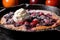close-up of bubbling berry cobbler in cast iron skillet