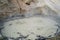 Close up of a bubbling mud pot in the Sulphur Works area of Lassen Volcanic National Park, a geothermal feature