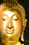 Close up Buddha face gold color.