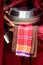 Close up of buddhist monk hands holding a bowl and cup