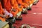 Close up of Buddhist monk prepare to pouring melt candle tears to the water for making blessing water