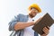 Close up of builder in hardhat with tablet pc