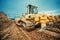 Close-up of bulldozer or excavator working with soil