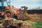 close up of bulldozer moving earth and leveling garden