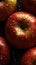 a close up of a bunch of apples with water droplets on them and a black surface with a few apples in the middle of the picture