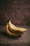 Close-up of a bunch of bananas on a brown background