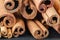 Close up bunch cinnamon sticks on dark wooden table