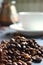 Close-up of a bunch of coffee beans scattered on the table