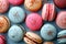 A close up of a bunch of different colored macarons, AI