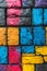 A close up of a bunch of different colored paint on bricks, AI