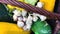 Close up of a bunch of Garlic and cucumber with other vegetables in a basket. Gardening and vegetables collection concept