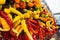 Close-up of bunches of peppers of various colors