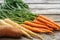 Close up of a bundle of carrots, parsnip and sweet potato