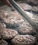 Close up of burgers on a barbeque