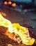 Close-up of burning,molten candles on a wax filled tray,at shrine next to the Bell Tower of Dumaguete,Negros Oriental,Philippines