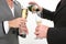 Close-up Business Couple Pouring Champagne