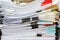 Close up of business papers stack on desk. Pile of unfinished documents on office desk