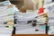 Close up of business papers stack on desk. Pile of unfinished documents on office desk