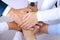 Close-up of business partners making pile of hands at meeting