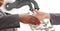 Close-up of business people shaking hands with money flowing from tap