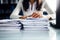 Close-Up of business Woman Organizing Documents, signing contracts