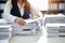 Close-Up of business Woman Organizing Documents, signing contracts