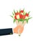 Close-up businessman hand holding bouquet flowers. Bouquet of red and white tulip. Concept congratulation with holidays