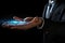 Close up of businessman hand touching with finger virtual panel with blue lights, Businessman hand using digital hologram