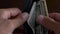 Close-up of a businessman hands counting hundred dollar bills