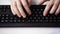 Close up of businessman hands typing on keyboard