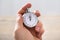 Close-up Of Businessman Holding Stopwatch